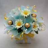 Chocolate box with artificial flowers